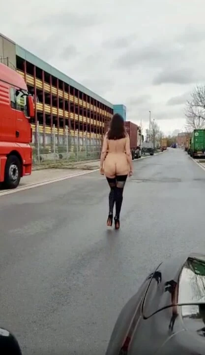 Naked Walk Between Trucks